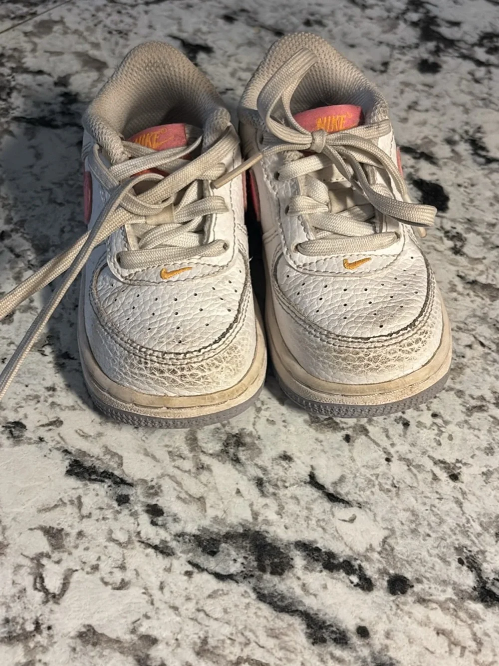 Nike Kids White Sneakers with Pink and Gold Accents